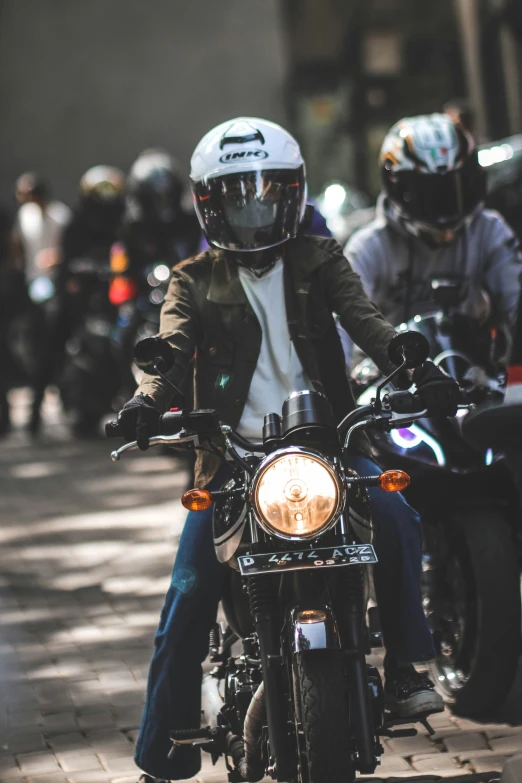 a man is riding a motorcycle on the street