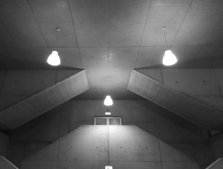 the ceiling in an old concrete building with bright lights