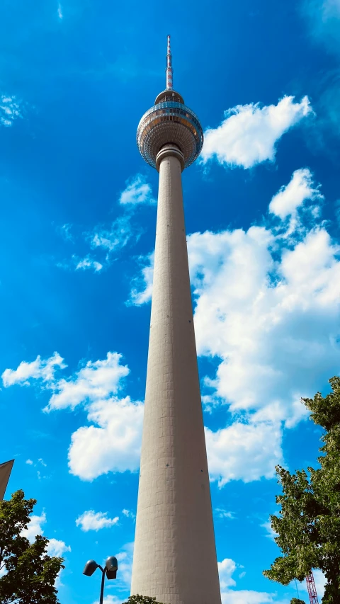 a very tall tower that has some nice clouds in it