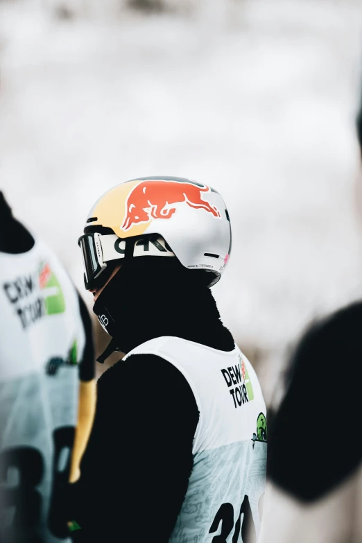 a close up of some riders on their snowboards