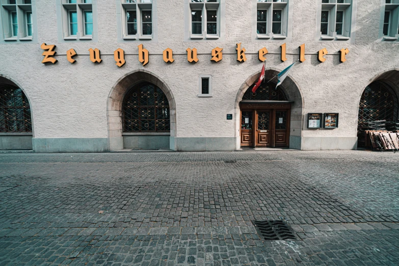 a large building with windows that have lights on the side