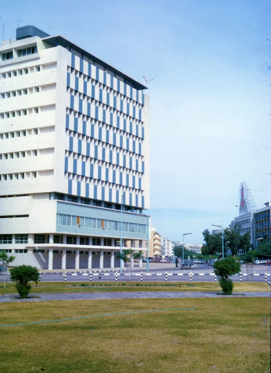 the large white building is next to other buildings