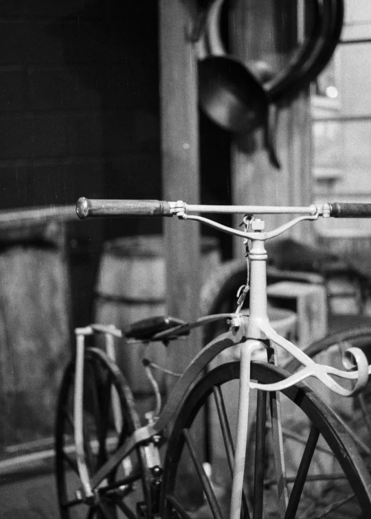 three antique bicycles parked next to each other