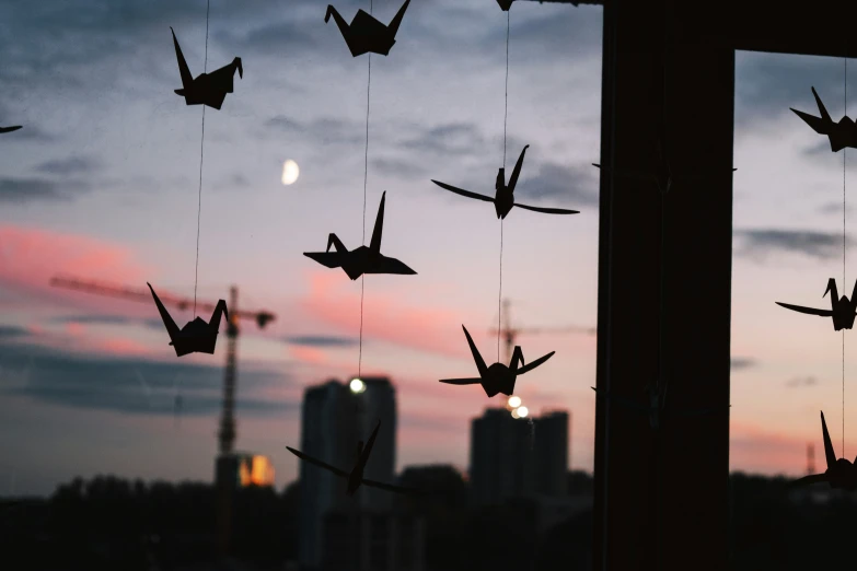 airplanes are being silhouetted against a twilight sky