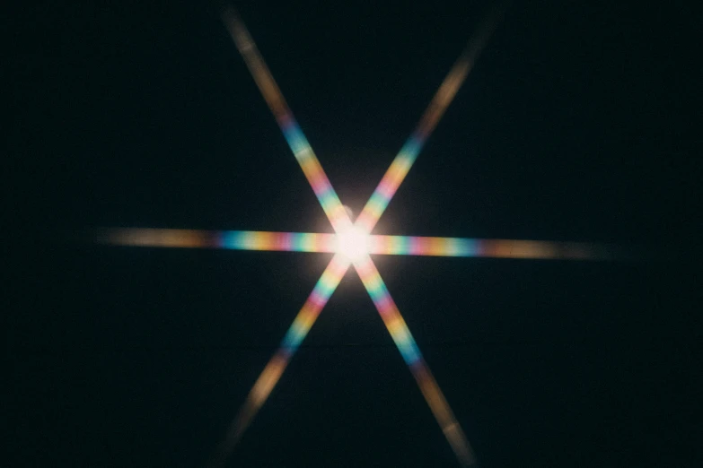 the star is surrounded by several thin white rays