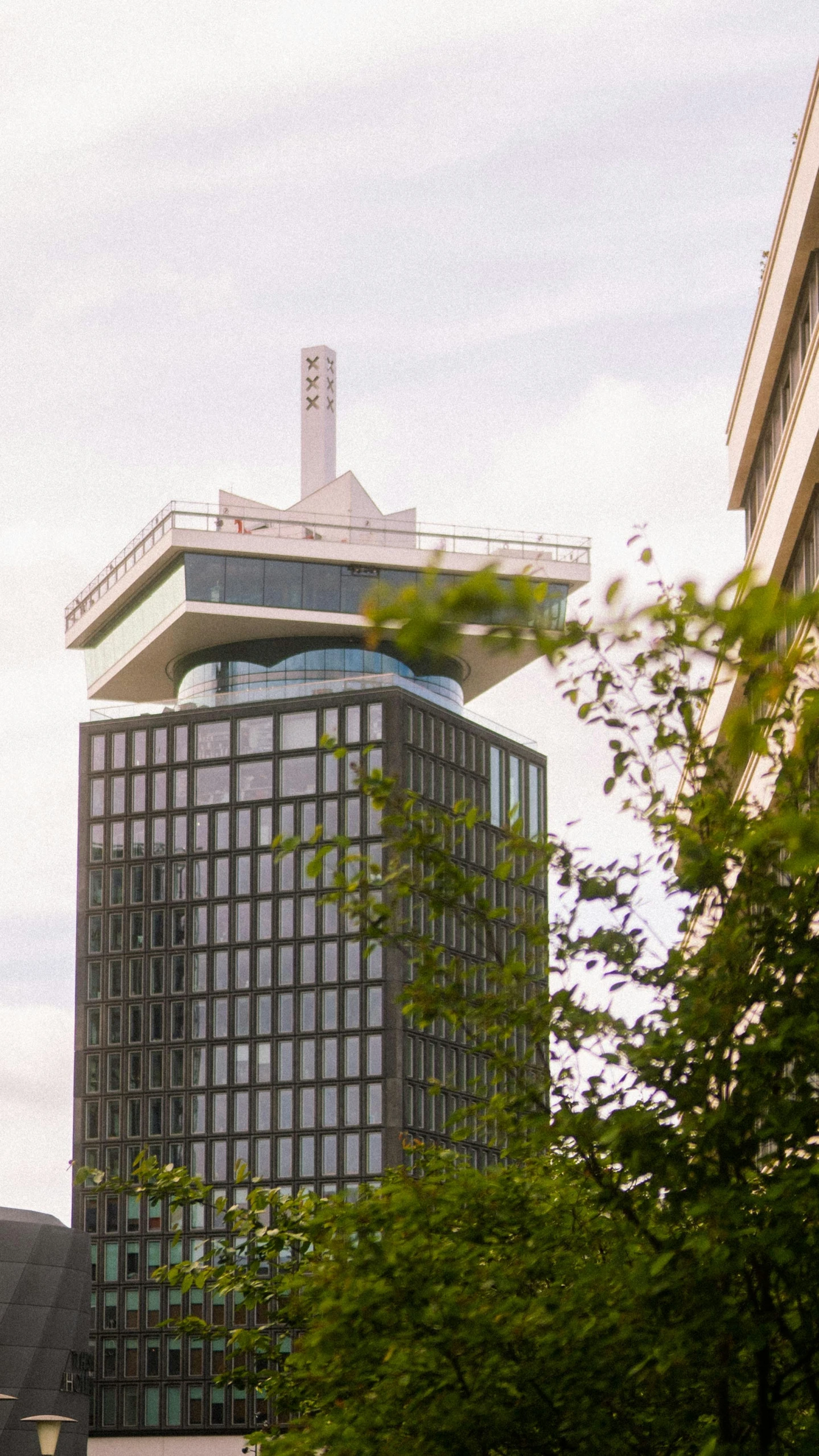 an office building and tall buildings near one another