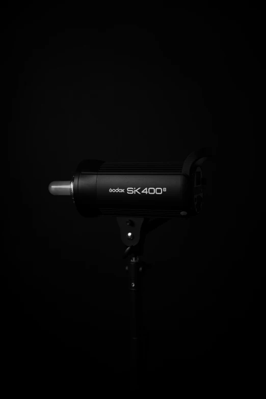an external hair dryer on the tripod on a black background