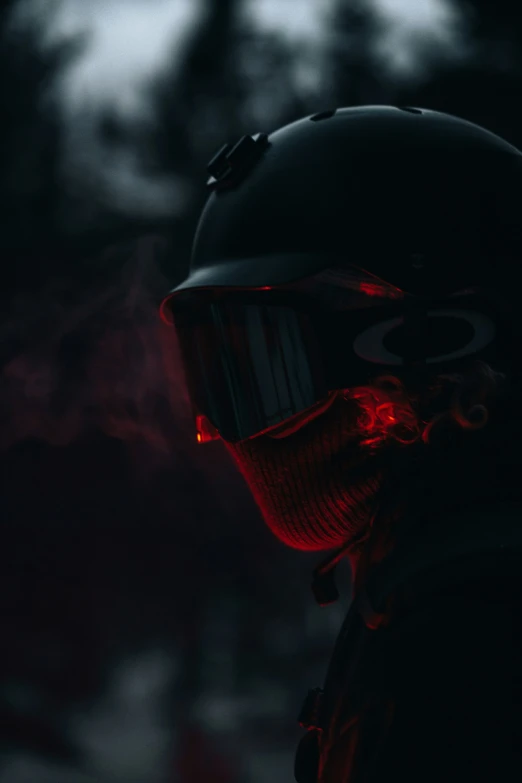 man wearing a helmet with red light on his face