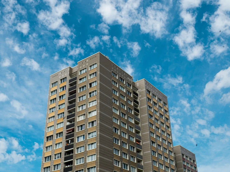 a very tall building with a sky background