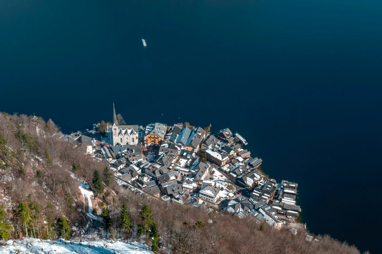 the large town is on top of a snowy hill