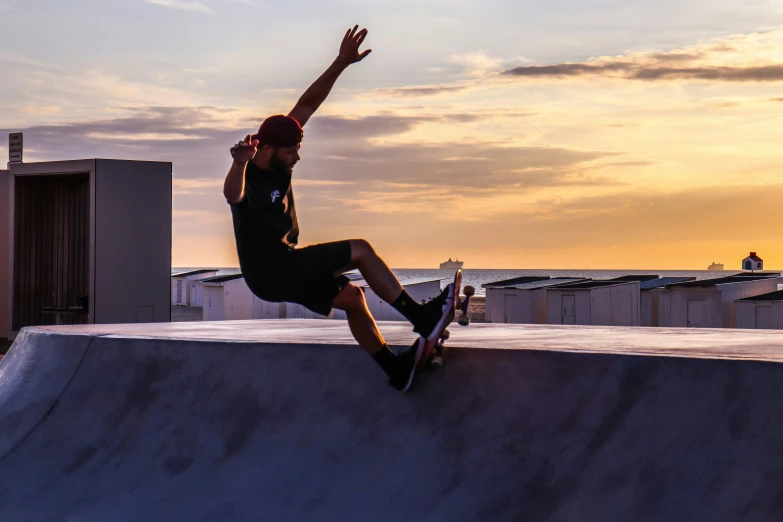 a skateboarder balances on the edge of the ramp in an urban setting