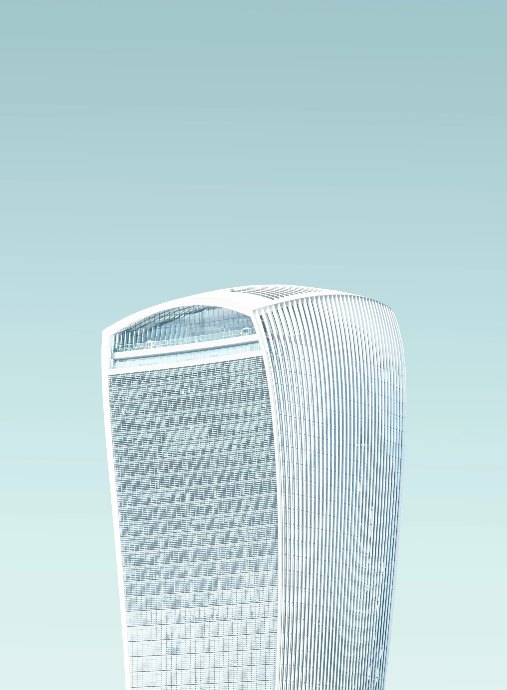 a high rise office building sitting on top of a hill