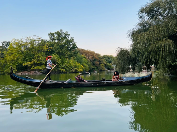 a boat that is sitting on top of a river