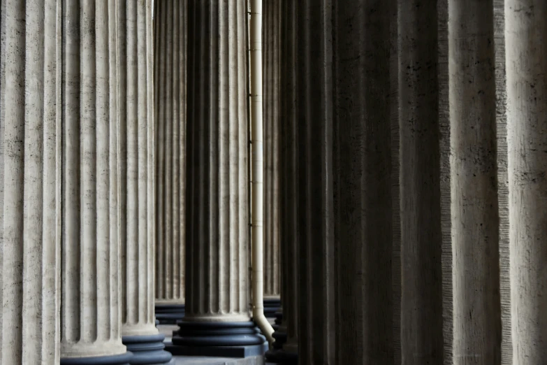 several different types of pillars lined up and sitting together