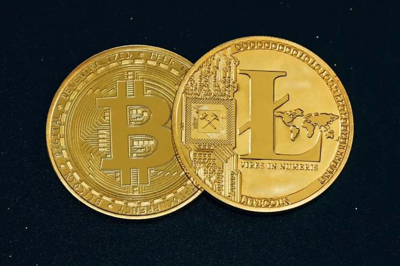 the front and back sides of a golden coin with a bitcoin on it