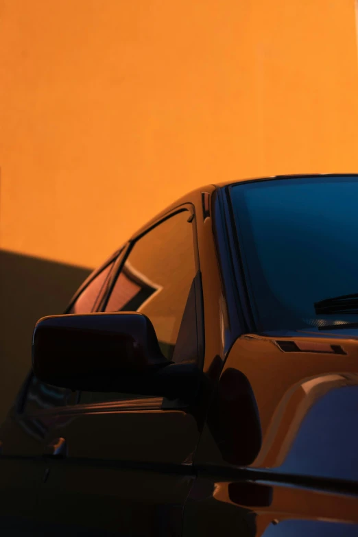 there is a side view mirror on the rear of a car