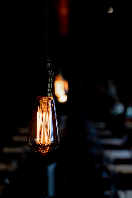 an image of a lit bulb hanging on a dining room