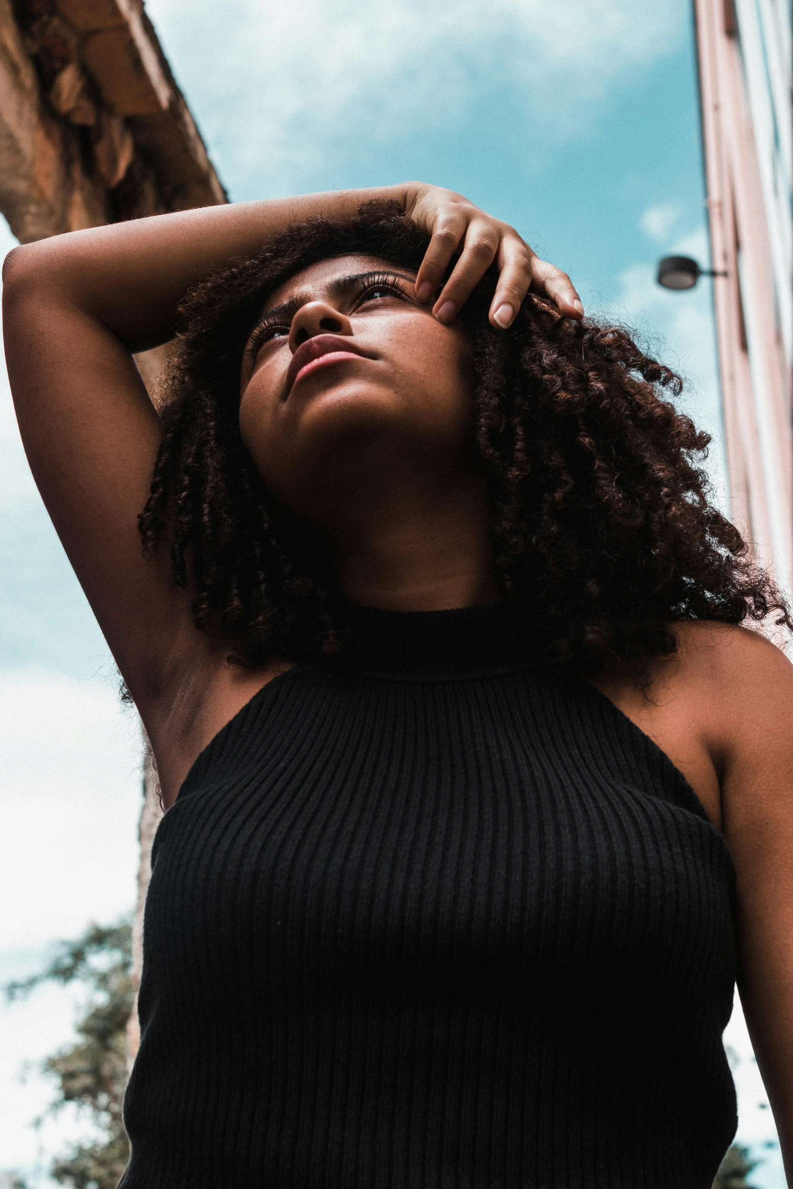 a woman looking up as she poses for a po