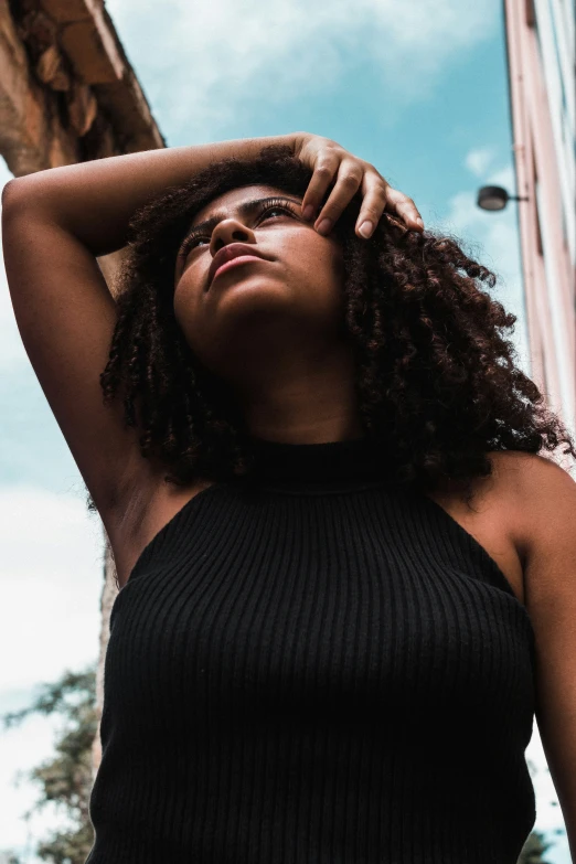 a woman looking up as she poses for a po