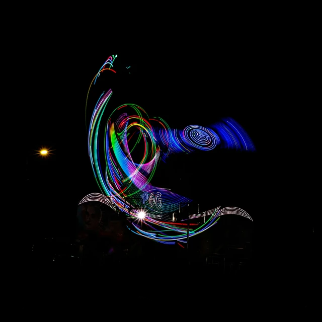 neon swirls in the dark are on display