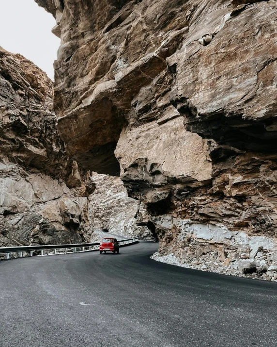 a road that is lined with big rocks