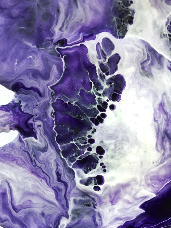 purple marble with white highlights has black spots