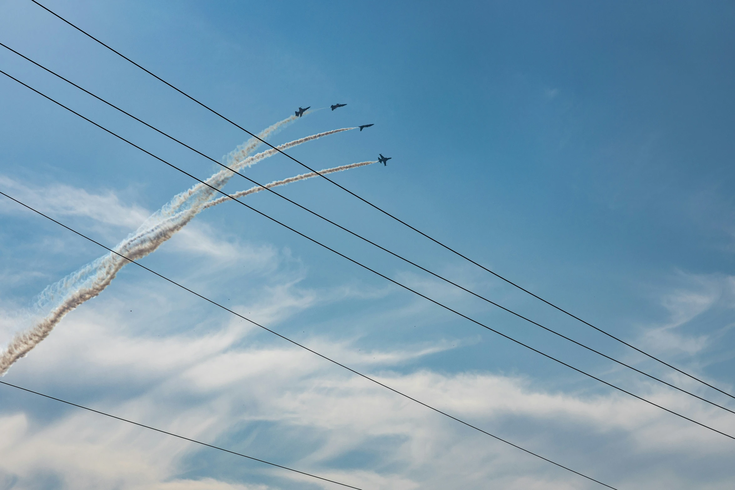 six airplanes that are flying in the sky together