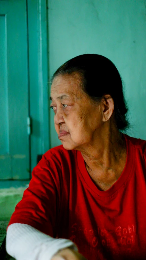 an older woman with her arm wrapped around a piece of paper