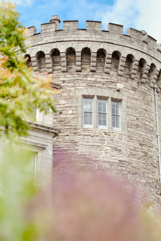 there is an old castle with a clock on the wall