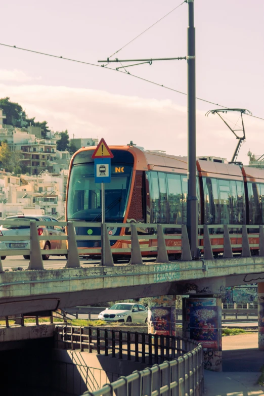 an elevated commuter train running over a bridge