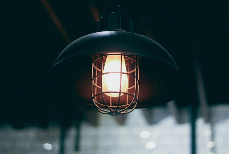 an old lamp fixture in a dark room