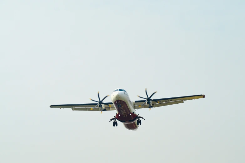 an airplane flying in a cloudless sky