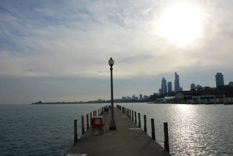 there is a dock that extends into the ocean