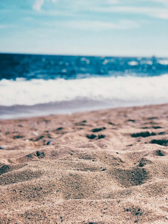 closeup of a surf board on the sand at a beach