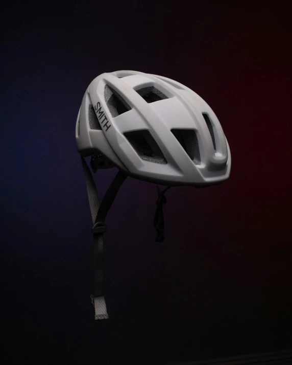 a helmet mounted on top of a pole in the dark