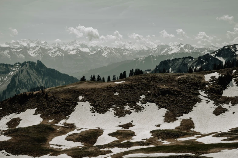 a mountain is shown with snow covered hills