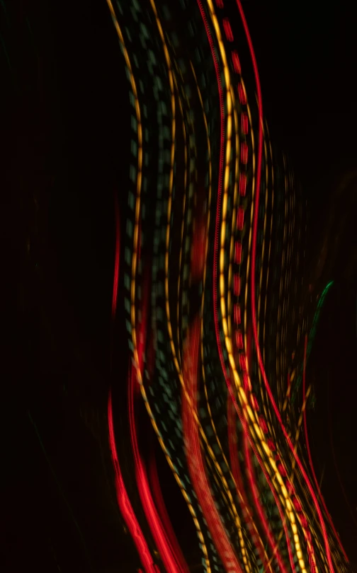 a street light streak with streaks of red and yellow