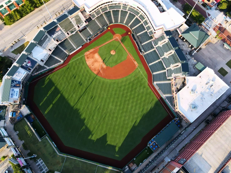 a baseball field in a large city