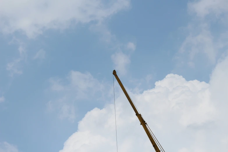 an industrial crane with two hands in the air