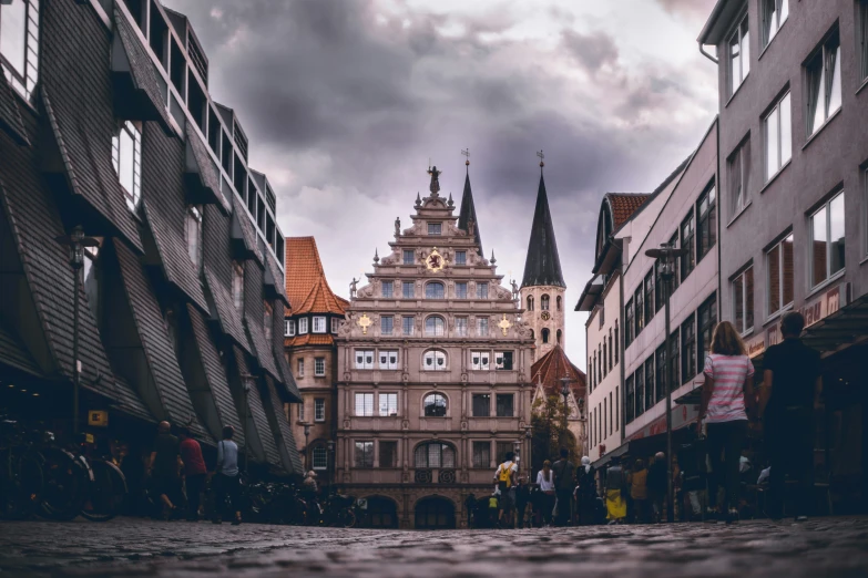 an old building sits between several large buildings