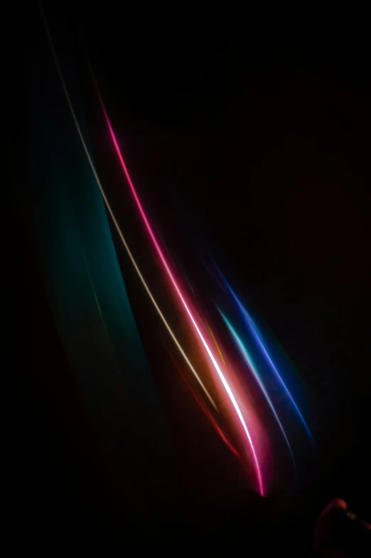 several long thin strips of color in the dark