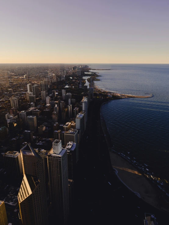 this is an aerial view of a city by the ocean