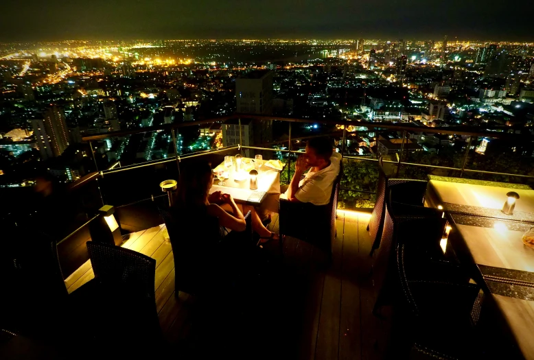 a table on top of a roof with lights on