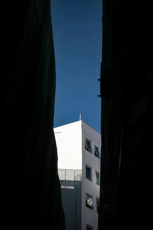 looking out from inside a window at buildings and sky