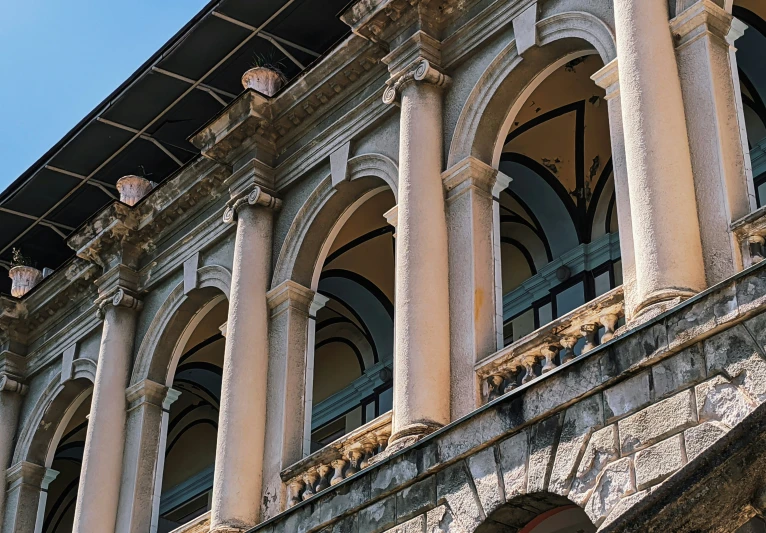 some pillars and lights are attached to the building