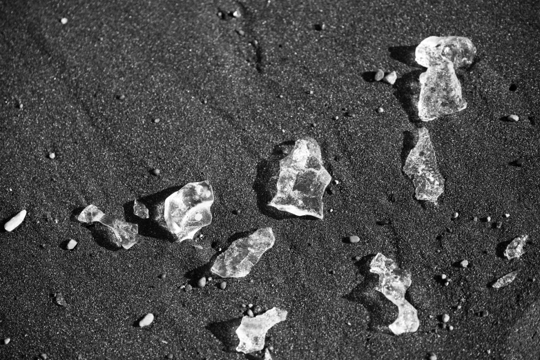 a po of ice cubes on a black surface