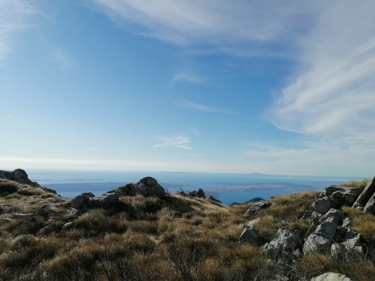 a bench on a hillside with a view