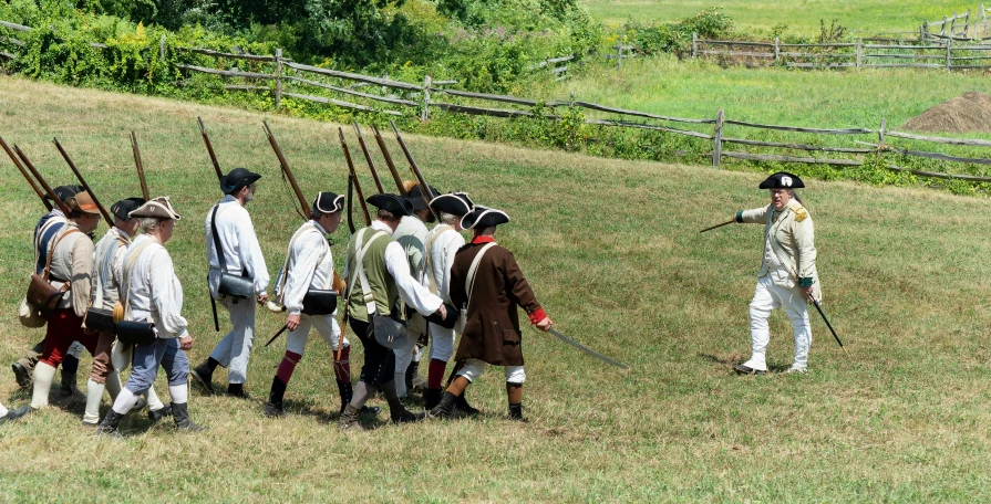 some men standing around with their backs turned