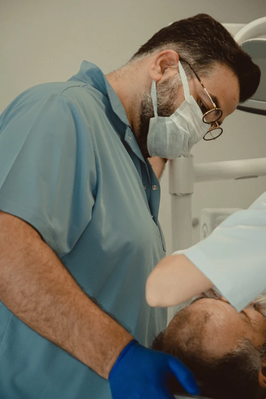 a man is putting bandages on his teeth