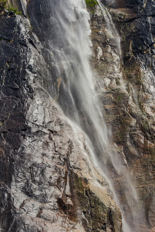 water pouring down the face of a mountain